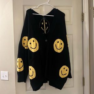 Dressed in Lala super soft and comfy oversized smiley face sweater.